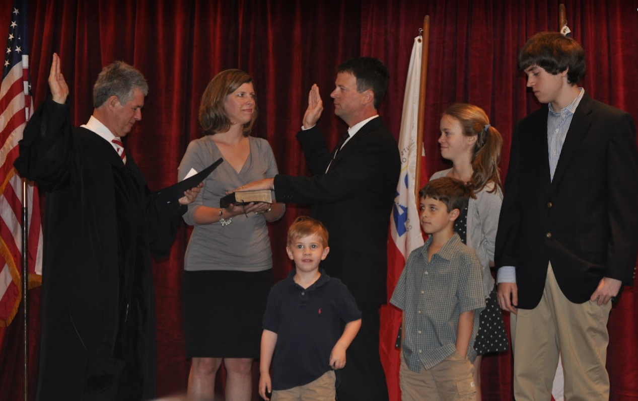 Alex Wright being sworn in with family
